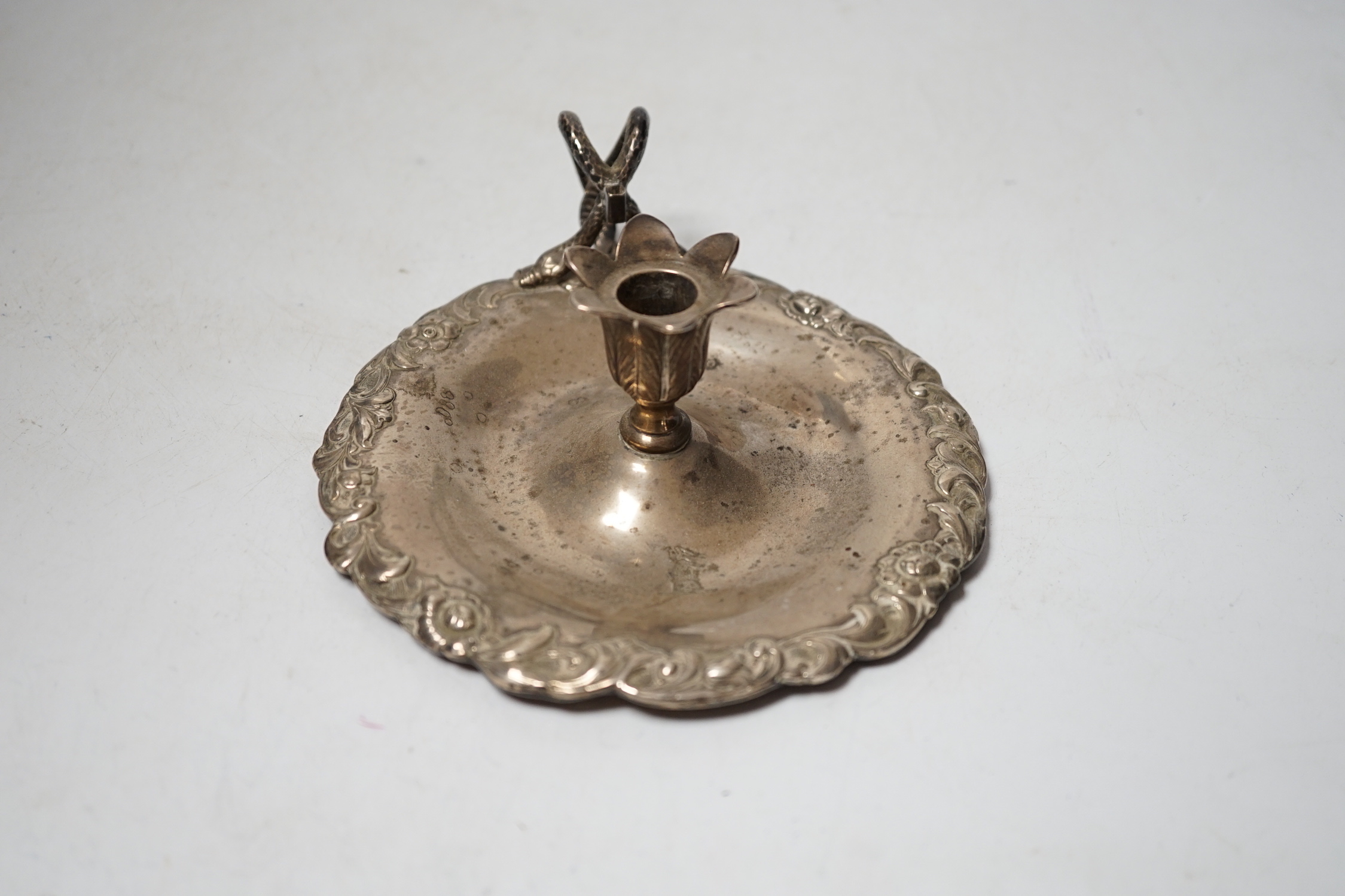 An early Victorian silver chamberstick, Robert Hennell III, London, 1842, with foliate border, 13.8cm, lacking snuffer, 5.9oz.